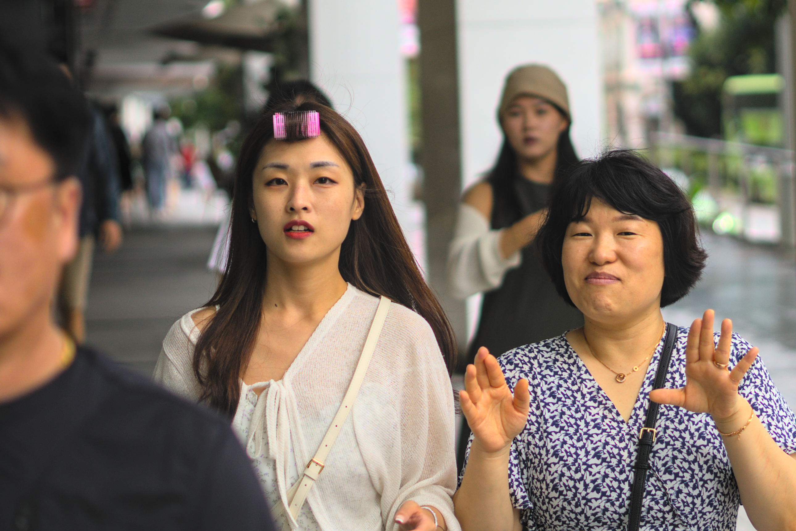 A woman with a hair curler