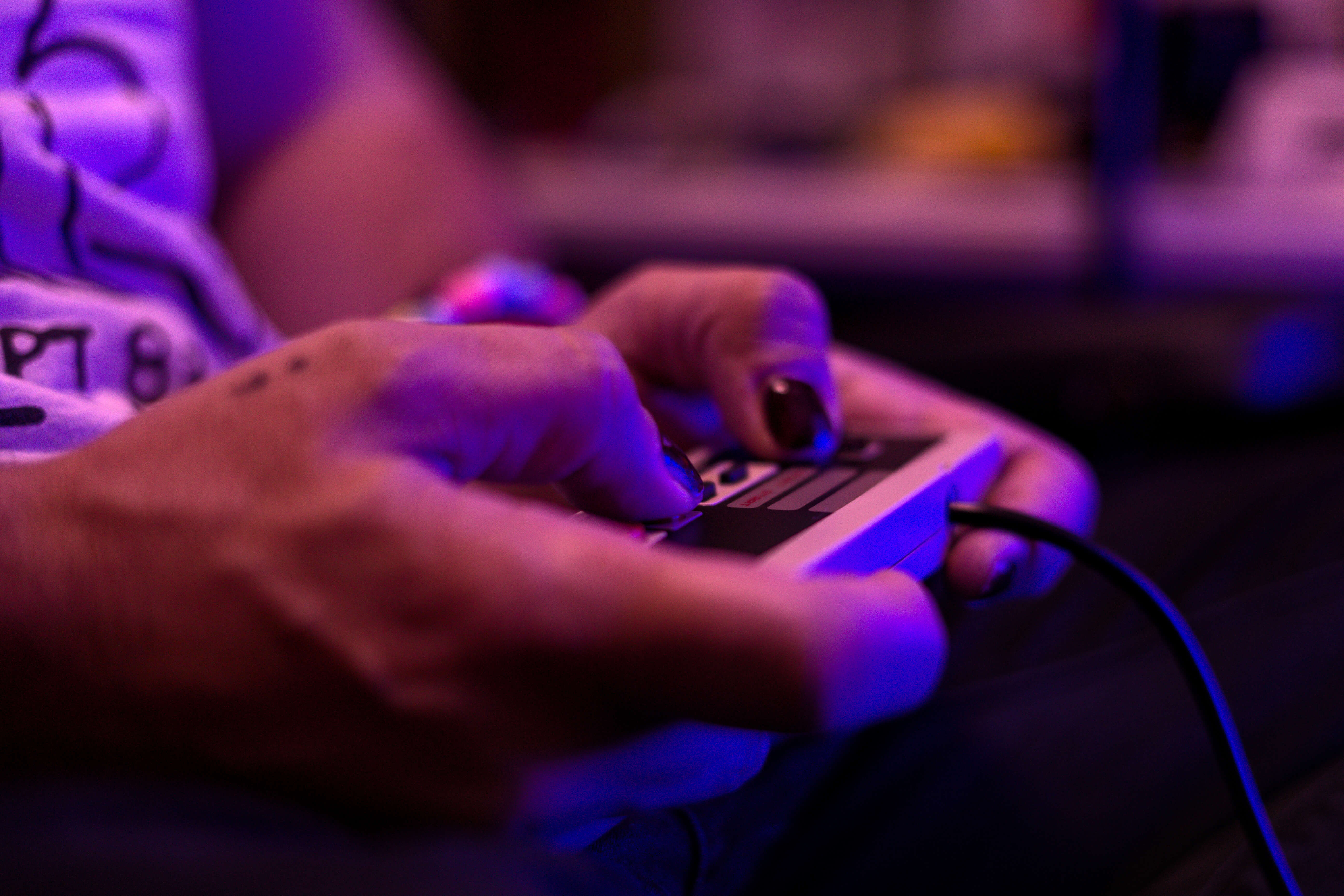 Hands on a retro game controller.