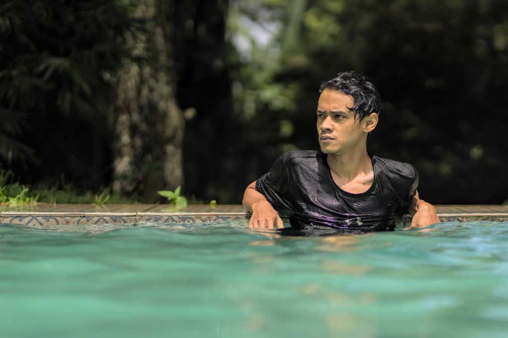 Team member taking a dip in the pool